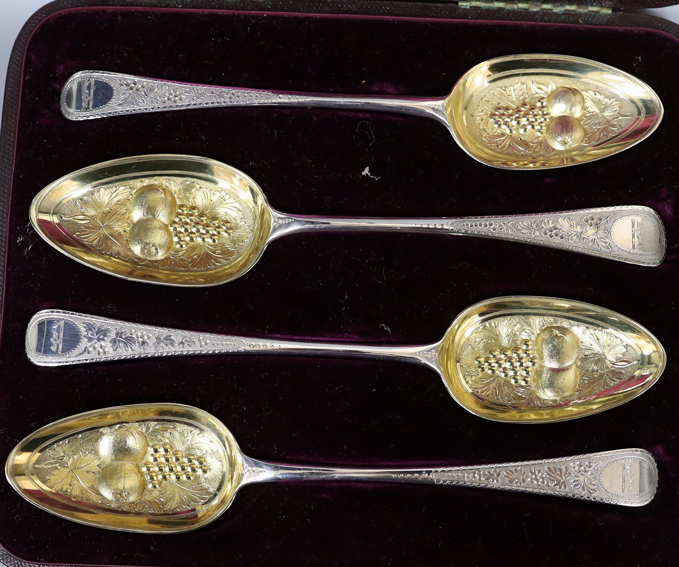 A cased matched set of four 19th century parcel gilt berry spoons, 7.5oz